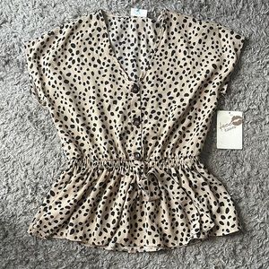 Tan and black dotted short sleeve dressy shirt. Size medium